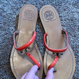 Tory Burch red leather flip flops with gold T